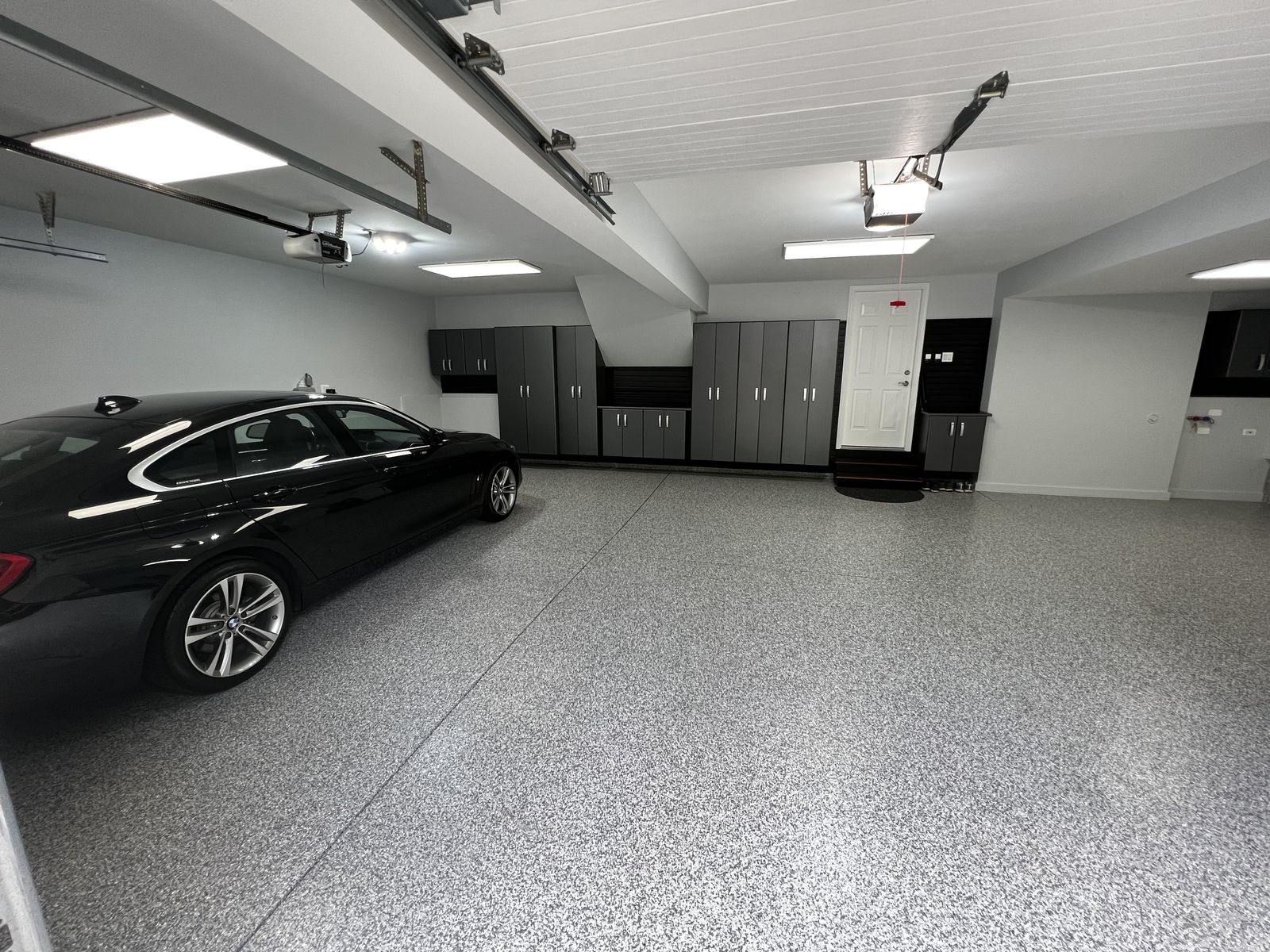 Polyaspartic flake garage floor by MK Concrete Coatings